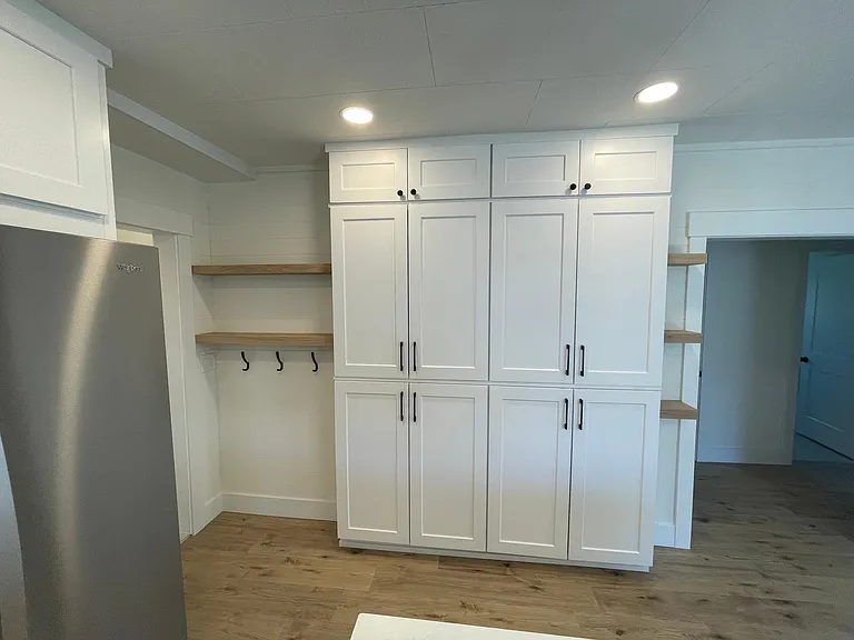Tons of cabinets and storage in the huge light and bright kitchen