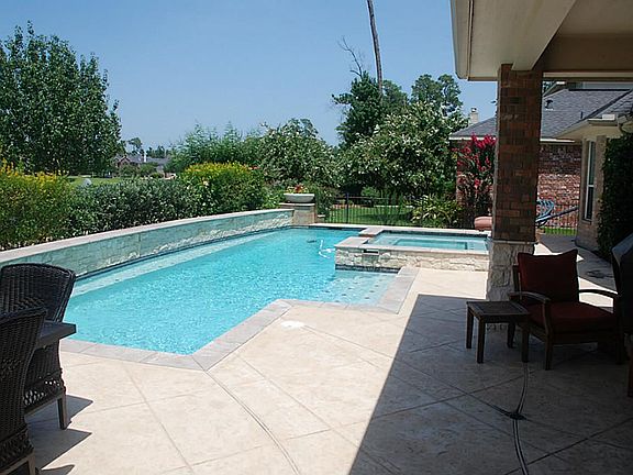 Enjoy a luxurious dip in this custom built pool.