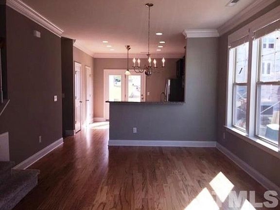 Another view of the open concept kitchen, dining, and living area