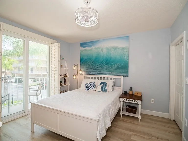Bedroom #2, queen size bed, private balcony with ocean view, ensuite bathroom and large walk-in closet.