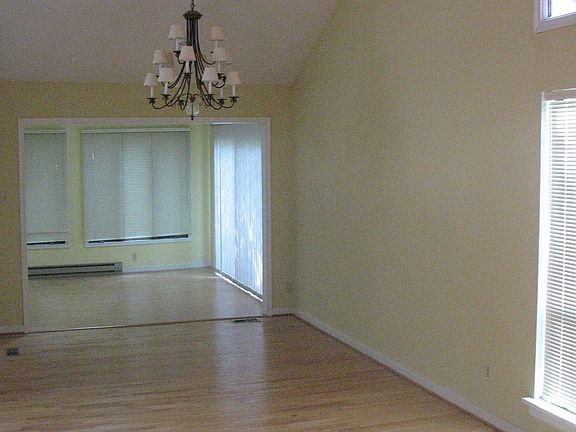 Dining room vaulted ceiling hardwood floors leads to Florida Room