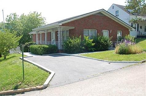 Large home, but cozy and readyto move into. Perfect retirement home--everything is on the main floor, yet there can be separate quarters in basement for extended family. Newly re-modeled with over-sized tiled bathroom upstairs--new tile, new carpet, and many other updates! In the updating, seller added stairway to the basement from the inside. Motor home hook-up in the wide driveway!
