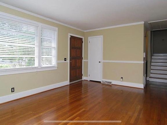 Gorgeous front door adds character and hall closet provides ample storage.