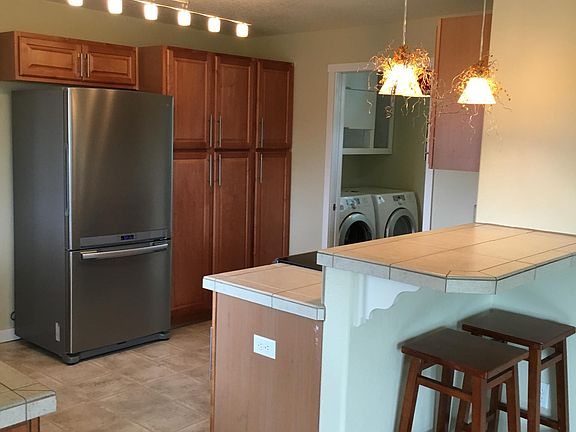 Kitchen with laundry behind pocket door