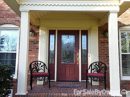 Front Porch
						:
						Dentil molding and arched brickwork on windows.