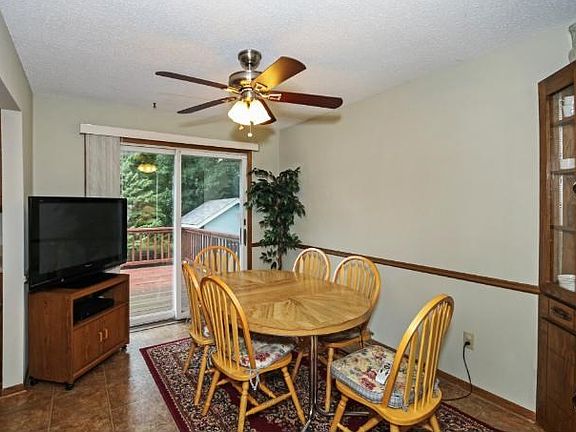 Dining Room has patio door over looking large deck.