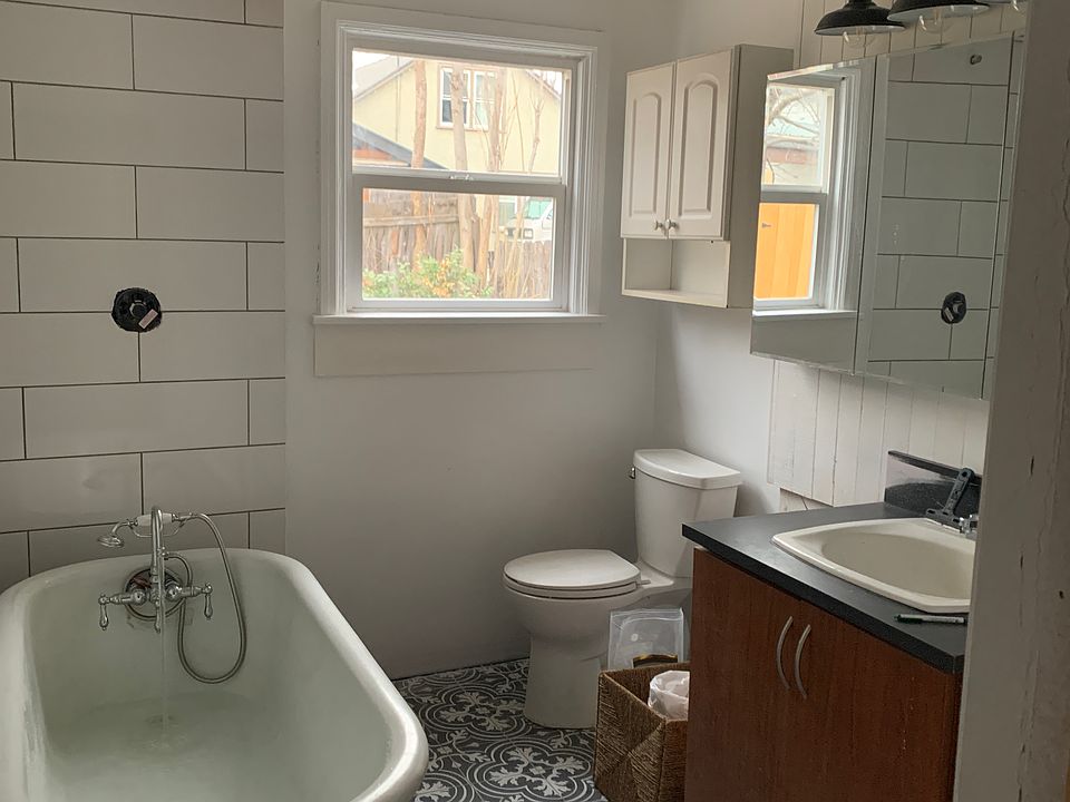 1 bathroom with claw foot tub and Shower.