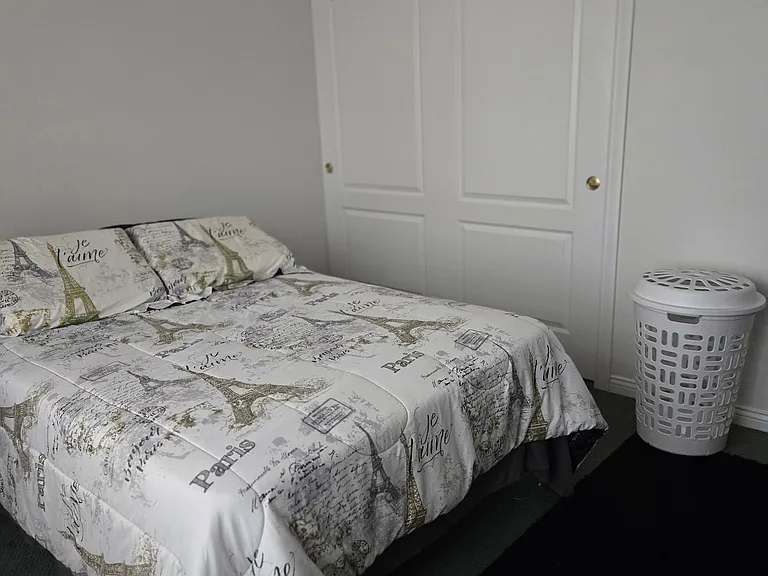 Bedroom 4: Full bed, dresser, wide closet, area rug, remote-controlled ceiling fan, curtains.