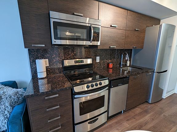 Kitchen, stove, oven, microwave, dishwasher, sink and cabinets furnished and ready for your arrival