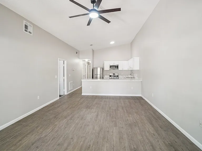 Light and bright open-concept living with modern, easy-to-clean flooring and no carpet!