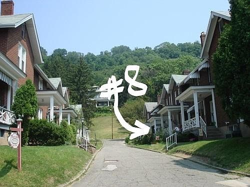 Canvas valances surround the porch and, yes ,it has a porch swing.
