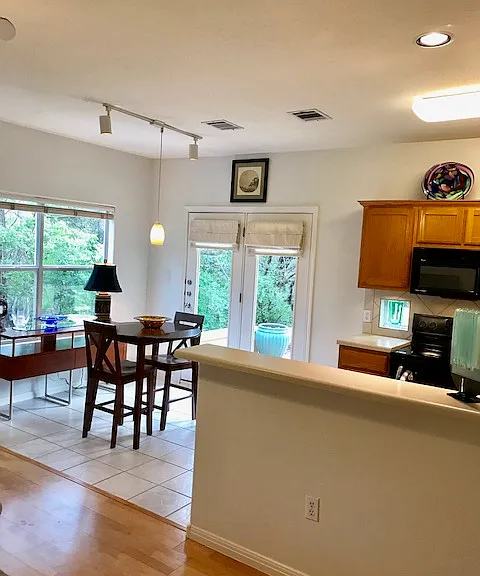 OPEN kitchen , living and dining area
Windows below kitchen cabinets allow nature to flow inside