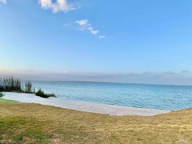 Just steps from the clubhouse and pool, a private beach area grants exclusive Perdido Bay access-perfect for launching kayaks and paddleboards.