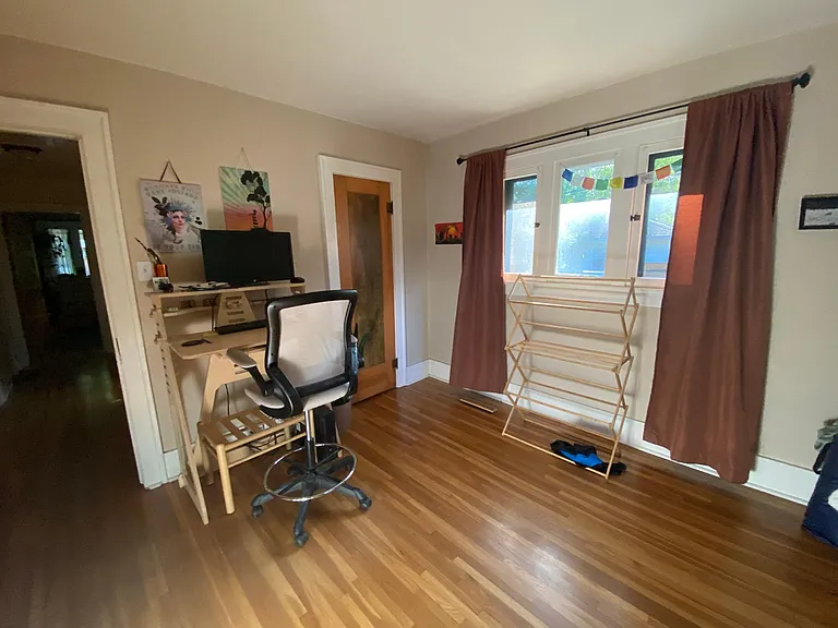 Back bedroom being used as an office. refurbished original doors throughout.