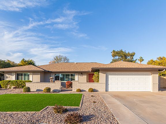 Great curb appeal with low maintenance landscape and plenty of parking