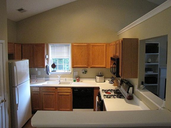 Kitchen opens to living room