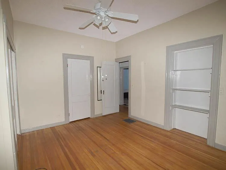 Bedroom with built in and two closets