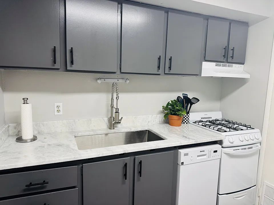 Explore the elegance and practicality of this stylish kitchen setup.