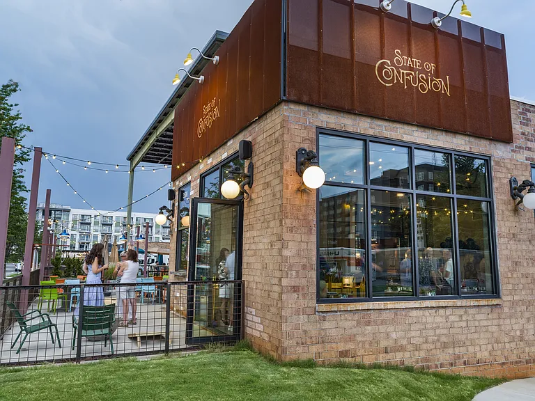 Enjoy the perfect mix of modern apartment living and vibrant local dining at Modera LoSo, conveniently located near State of Confusion. Savor unique dishes and craft cocktails in Charlotte's South End while experiencing the comfort and style of your new h