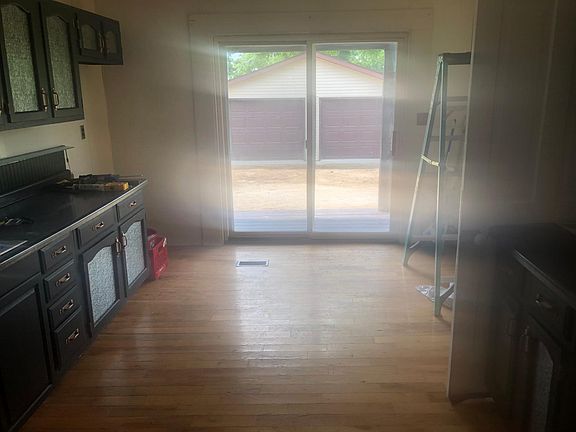 Kitchen sliding glass door leads to back patio