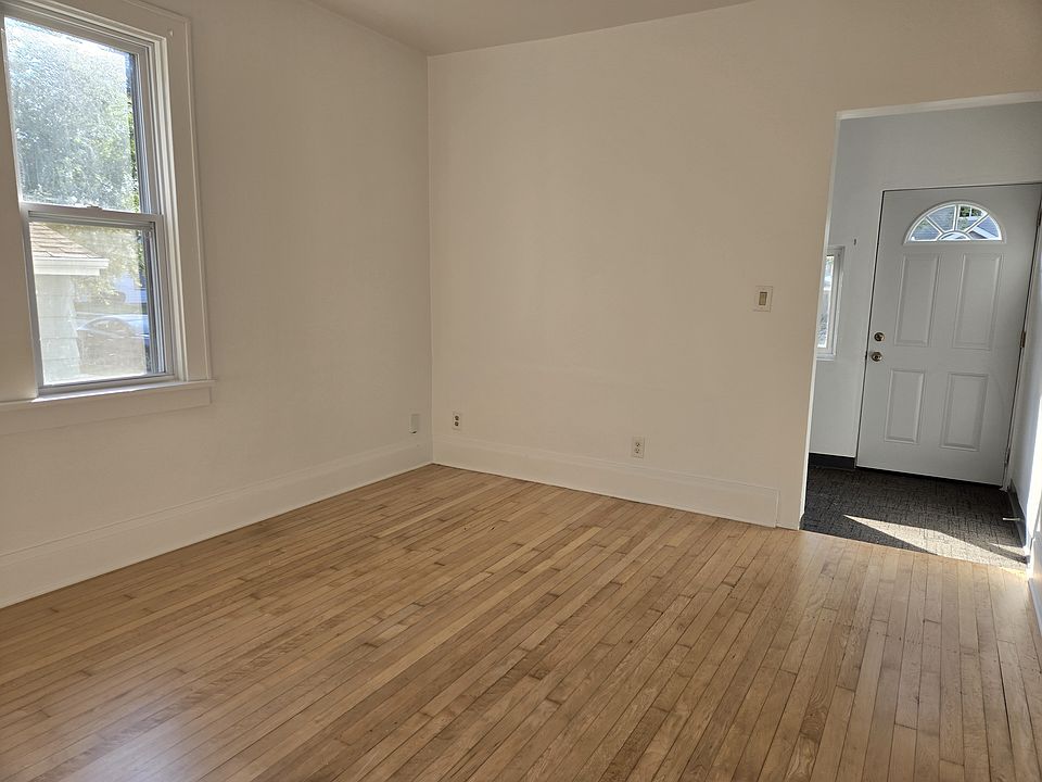 Living room looking southeast toward the front door and sun room / office