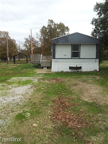 Large yard, large storage shed and covered carport.