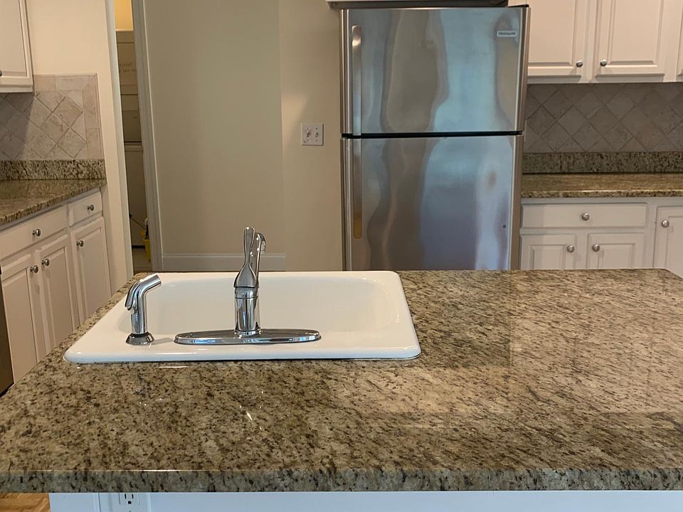 Island in updated, gorgeous eat-in kitchen. Notice the granite countertops and stainless steel appliances.