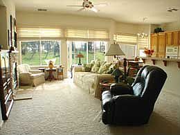 living room with golf cours view