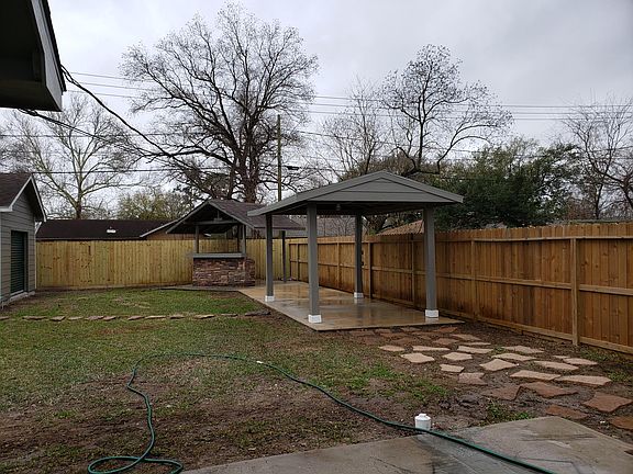 Back Yard with two patios and 6 foot wooden fence