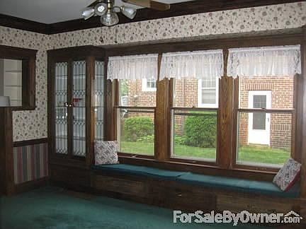 Dining Room
						:
						Natural woodwork, leaded glass cabinets, and window seat.