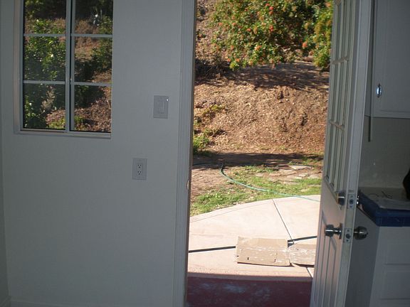 Kitchen door opens to spacious back yard
