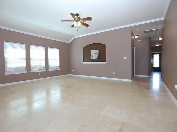 Another view of the family room, with crown molding and vaulted ceilings.