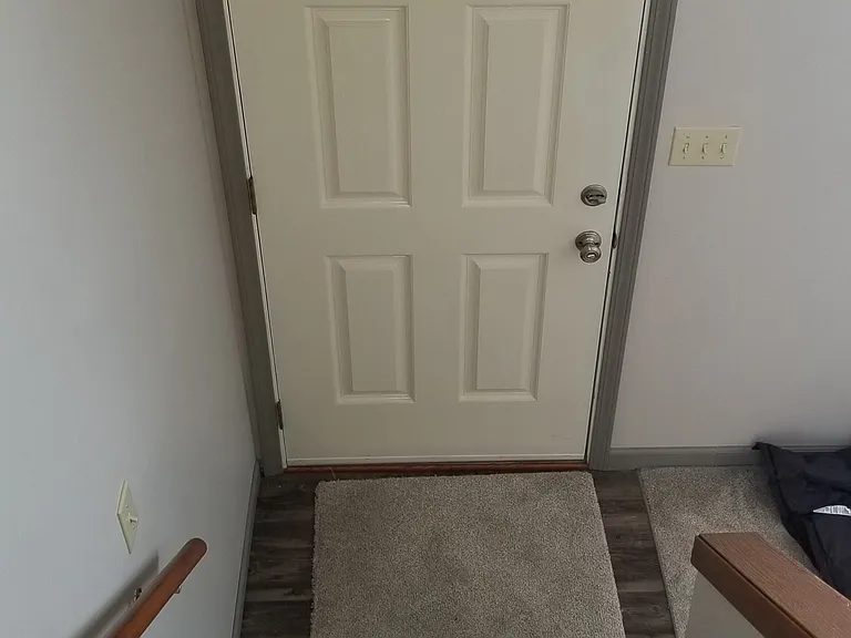 Stairs down to front door.