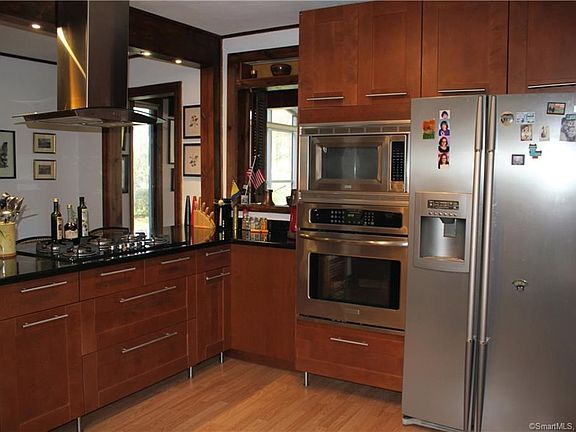 Remodeled First floor kitchen with stainless steel appliances, granite counter tops and breakfast bar.
