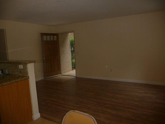 Spacious, open living room, parking spot close out to the le