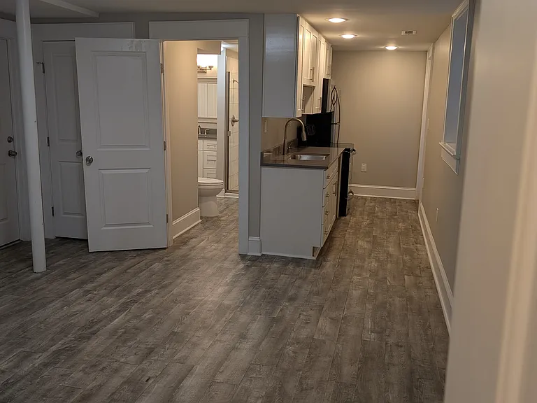 View of kitchen and bathroom and main area