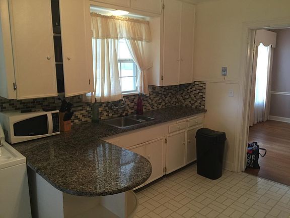 Granite countertops and lots of cabinets for storage