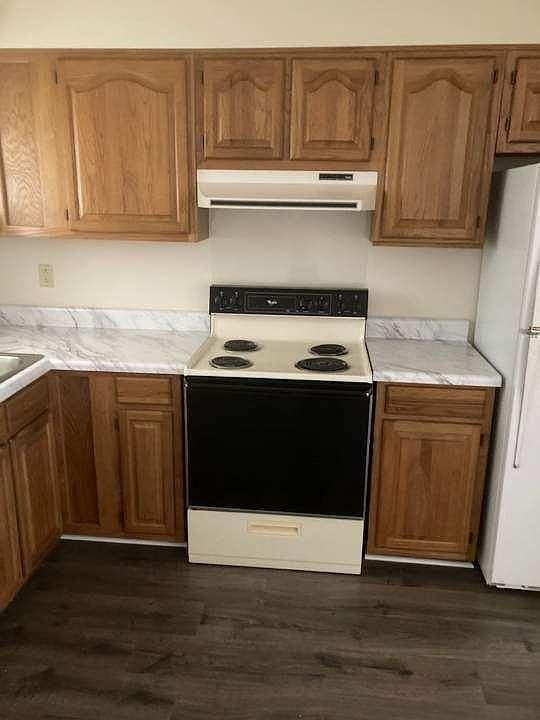 New hardwood floors in kitchen with new counter tops.
