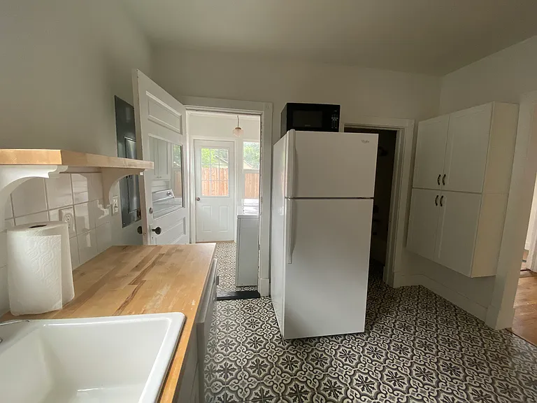 View from Kitchen with Laundry room on left and bathroom on right