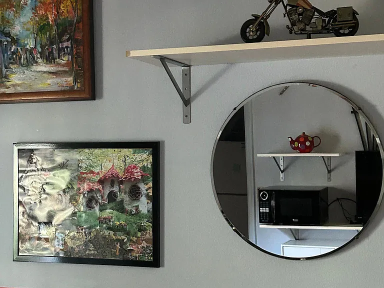 In the Suite sitting room. Collages, bike art.