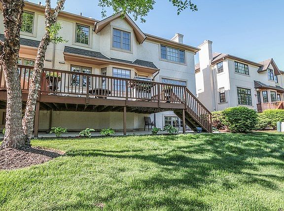 Grand back yard with water view.  Luxury home living. Paito and deck with look out lower level.