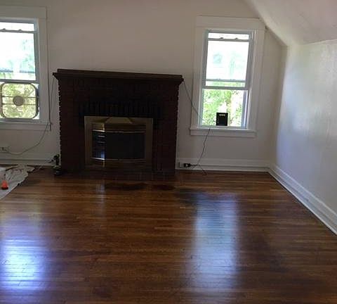 Large and bright living room with fireplace