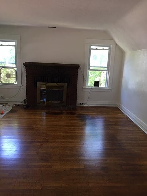 Large and bright living room with fireplace