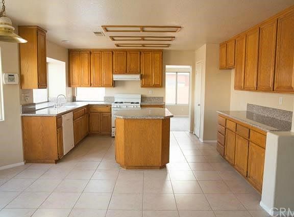 The Kitchen with Granite Countertops.