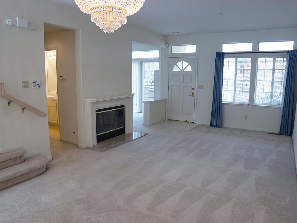 Living room with chandelier and gas fireplace