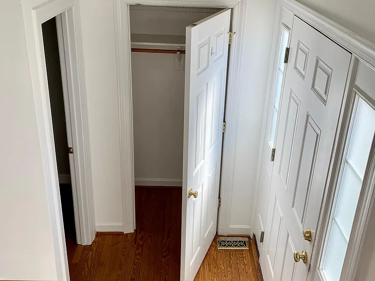 Foyer with powder room and coat closet.