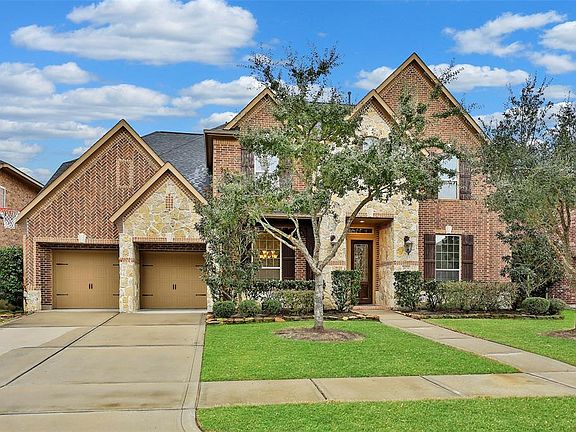 26731 Cedardale Pines is located in a particularly pretty neighborhood a couple blocks from a large open green space and park. Neighbors regularly gather to play soccer and other games!