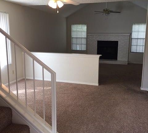 Separate dining area and living with fireplace. Carpet being replaced with hard surface.
