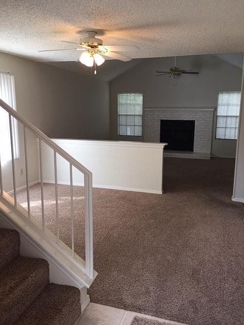 Separate dining area and living with fireplace. Carpet being replaced with hard surface.