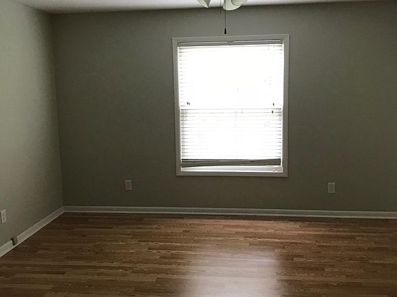 Master Bedroom with hardwood and granite double vanity
